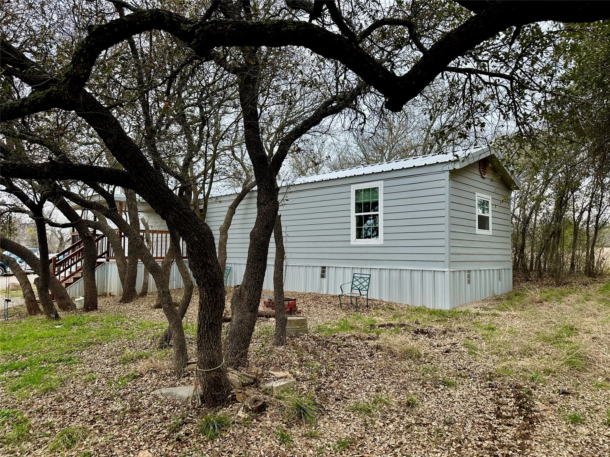 View of property exterior with a metal roof