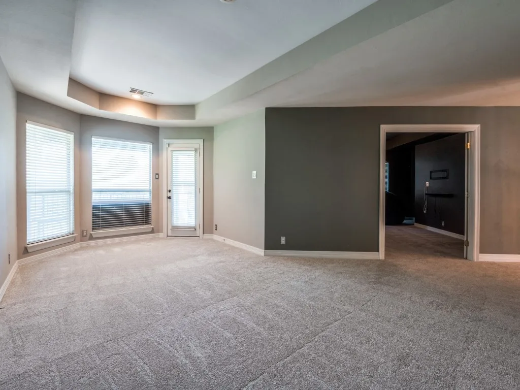 Game room has a balcony overlooking the pool.