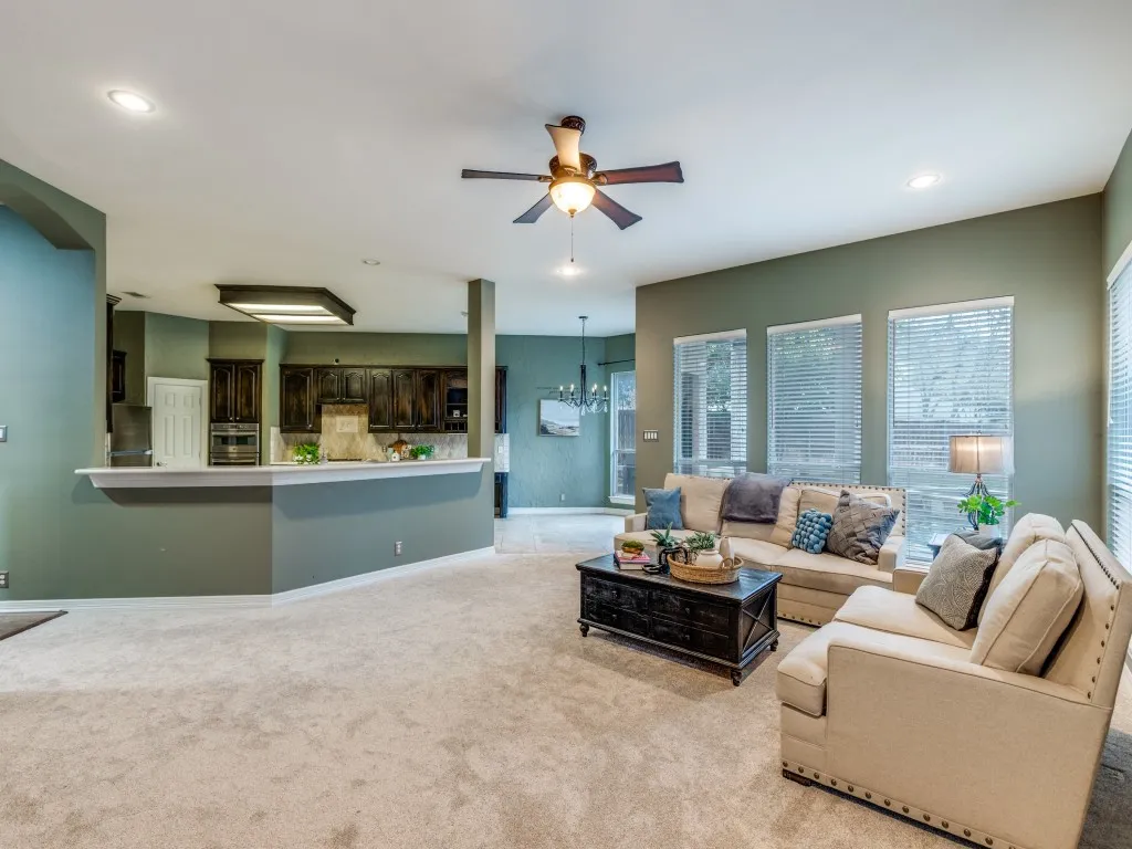 This room has been painted beige. Plenty of room for more seating.