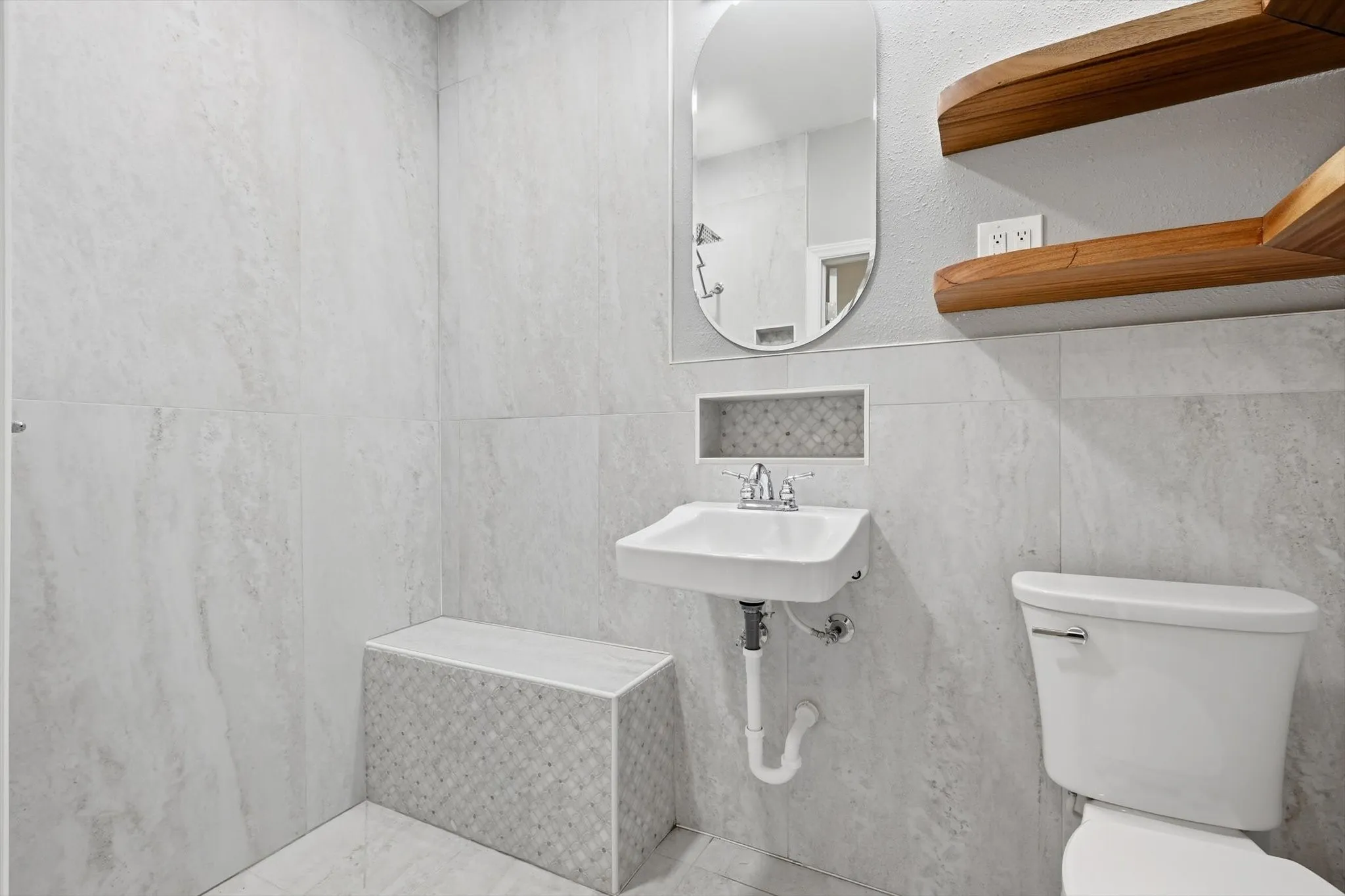 Bathroom with toilet and a textured wall