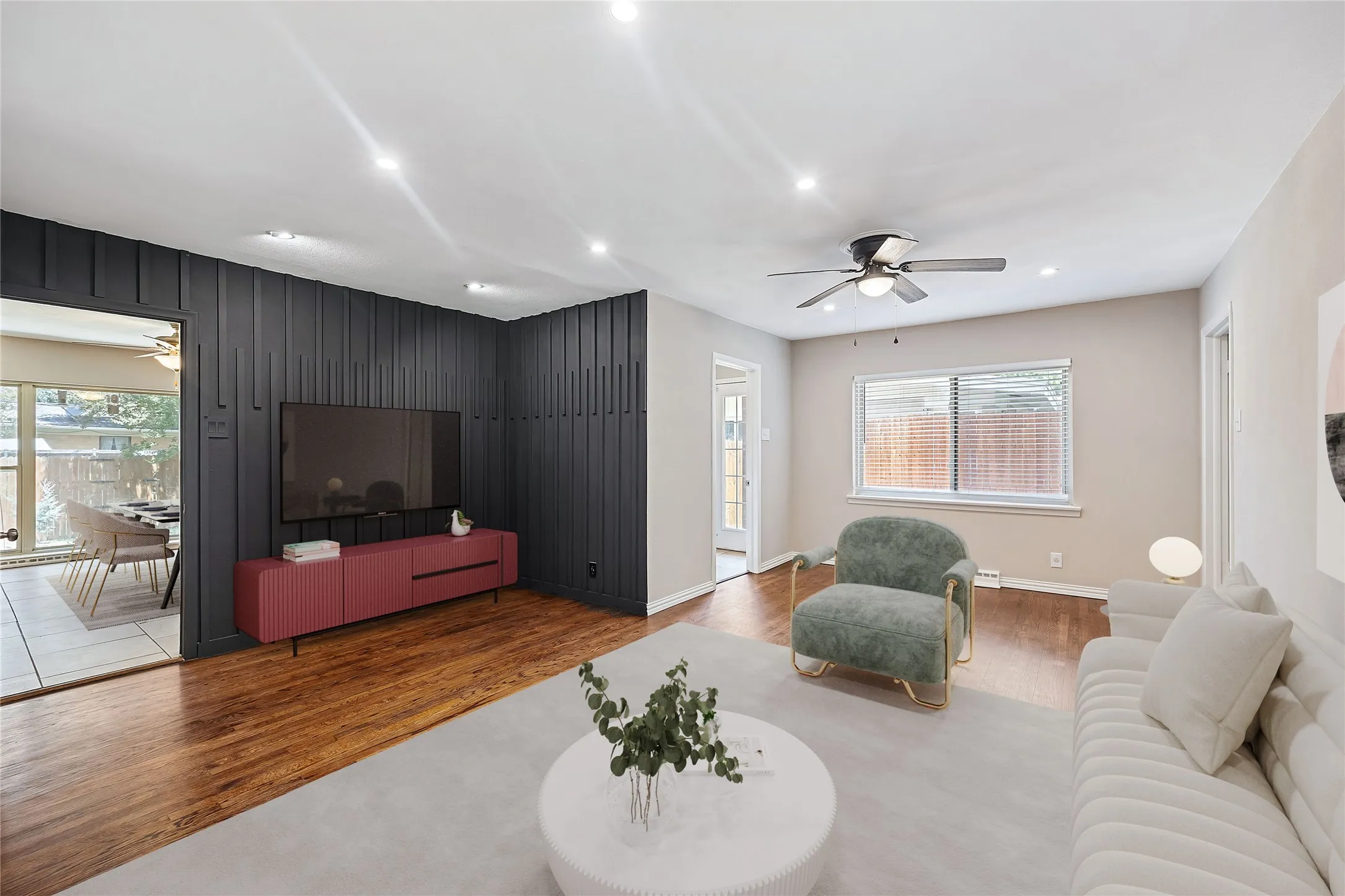 Living area featuring a ceiling fan, light wood finished floors, healthy amount of natural light, and recessed lighting