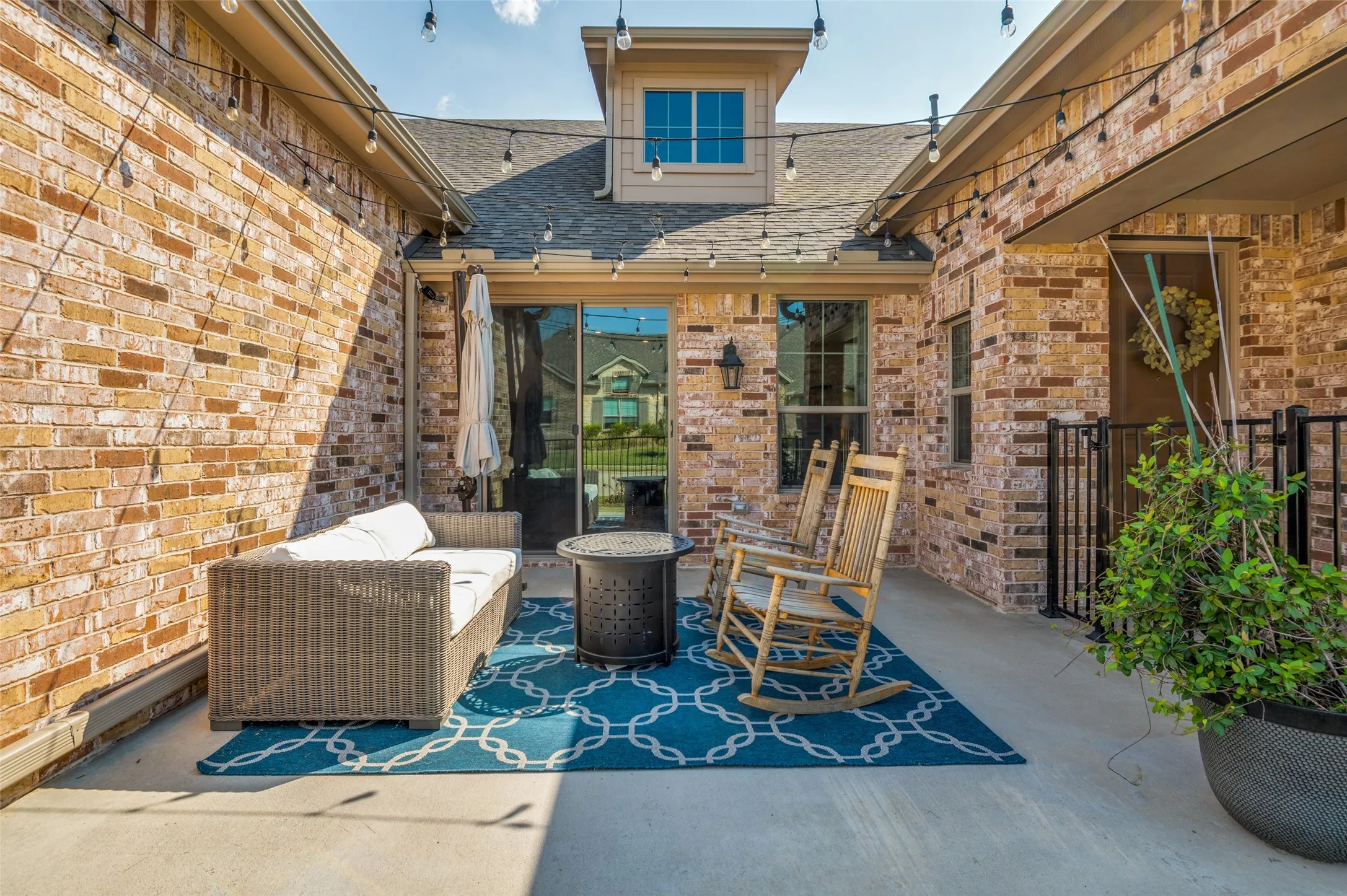 Inviting patio with space for outdoor seating, perfect for relaxing or entertaining year-round.