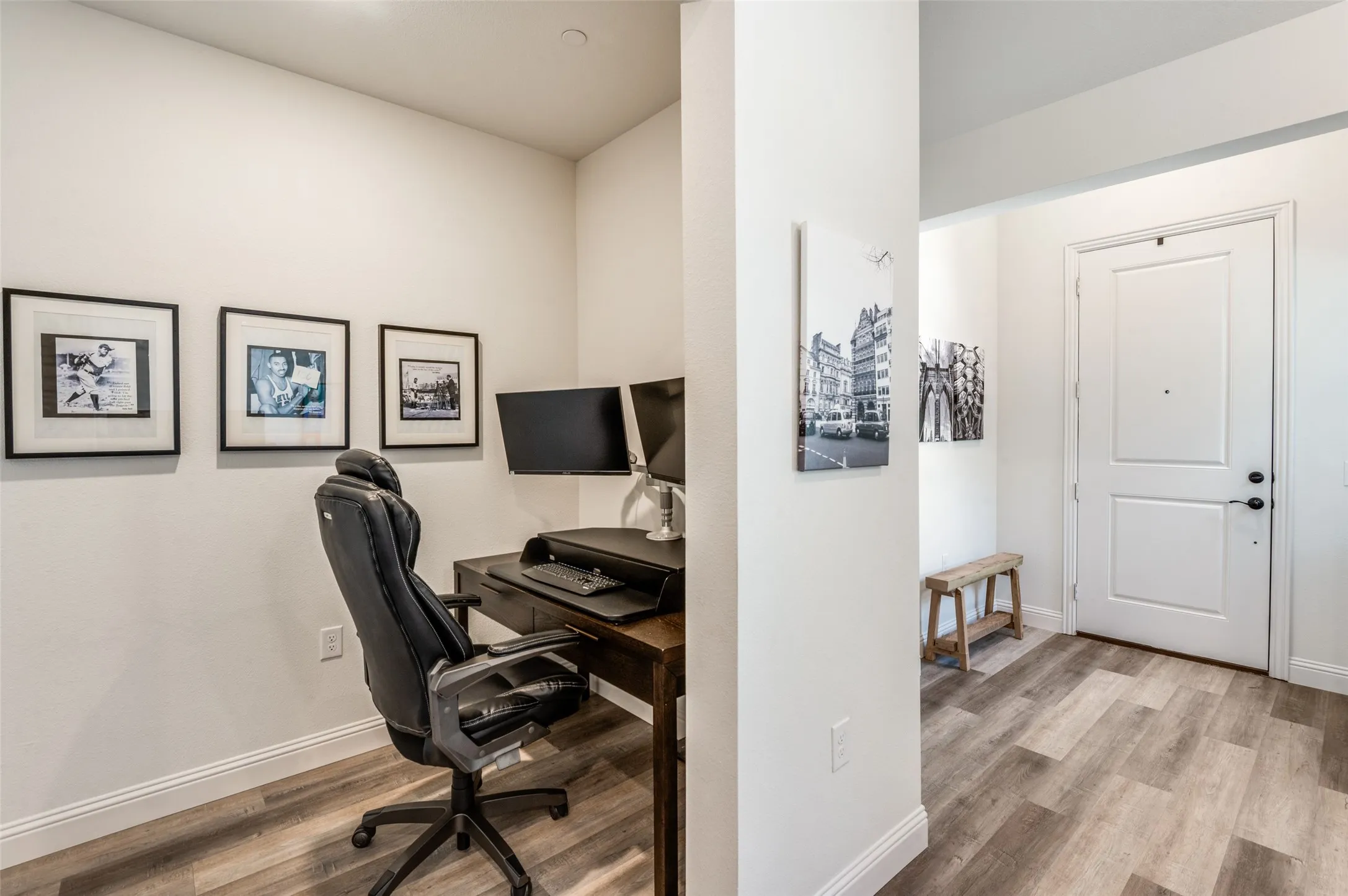 Dedicated workspace near the entry offers a convenient spot for working from home or managing daily tasks.