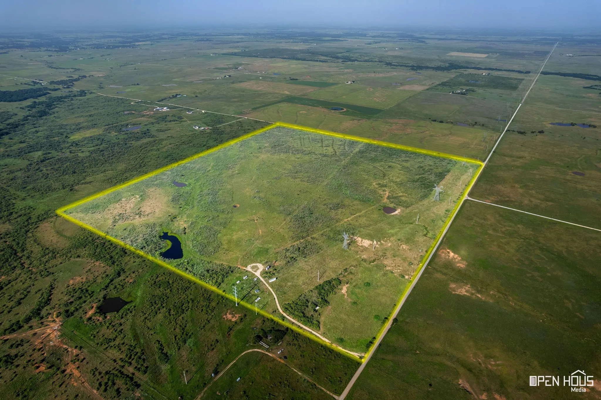 Overview of rural landscape with property parcel outlined