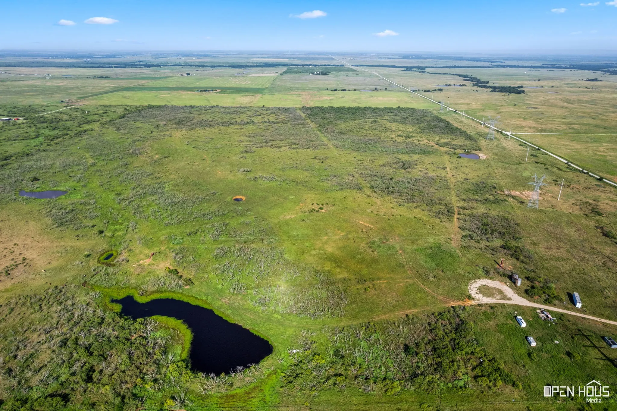 Aerial view of sparsely populated area with a nearby body of water