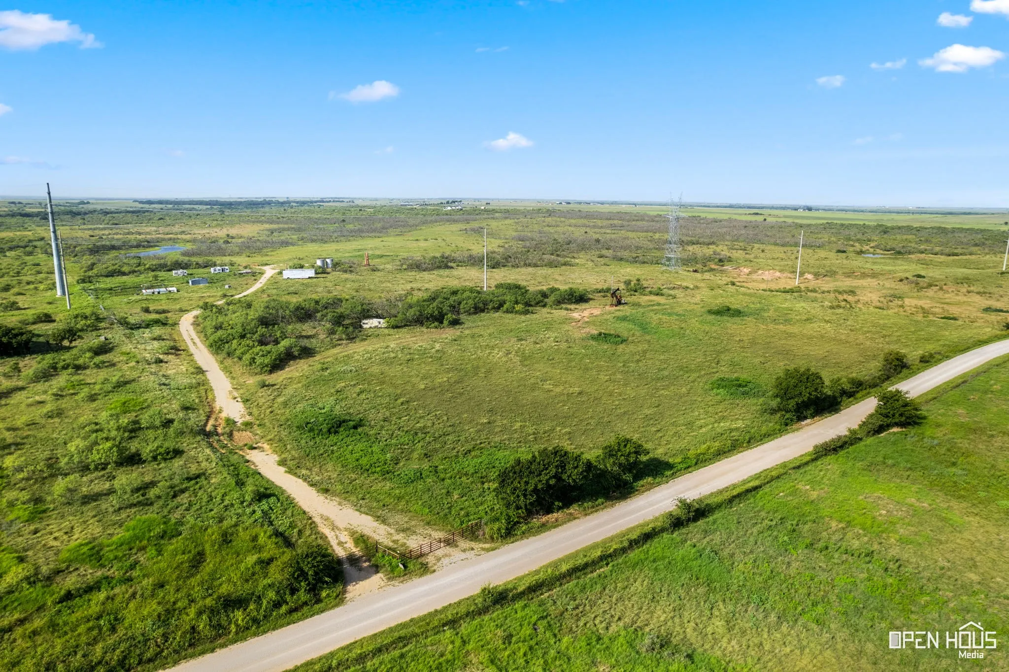 Aerial view of property and surrounding area with rural landscape