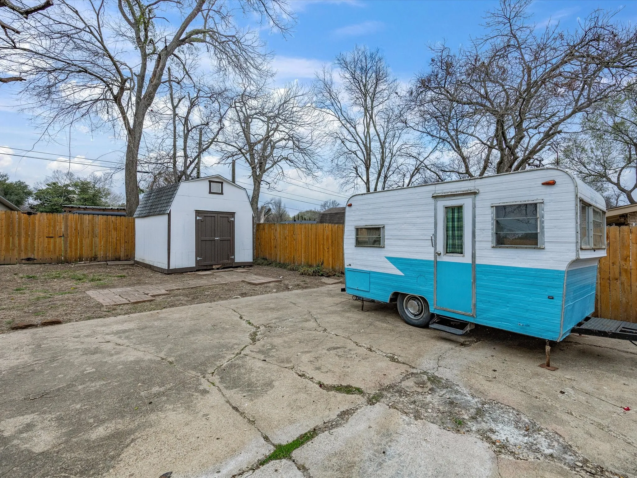 View of shed with a fenced backyard