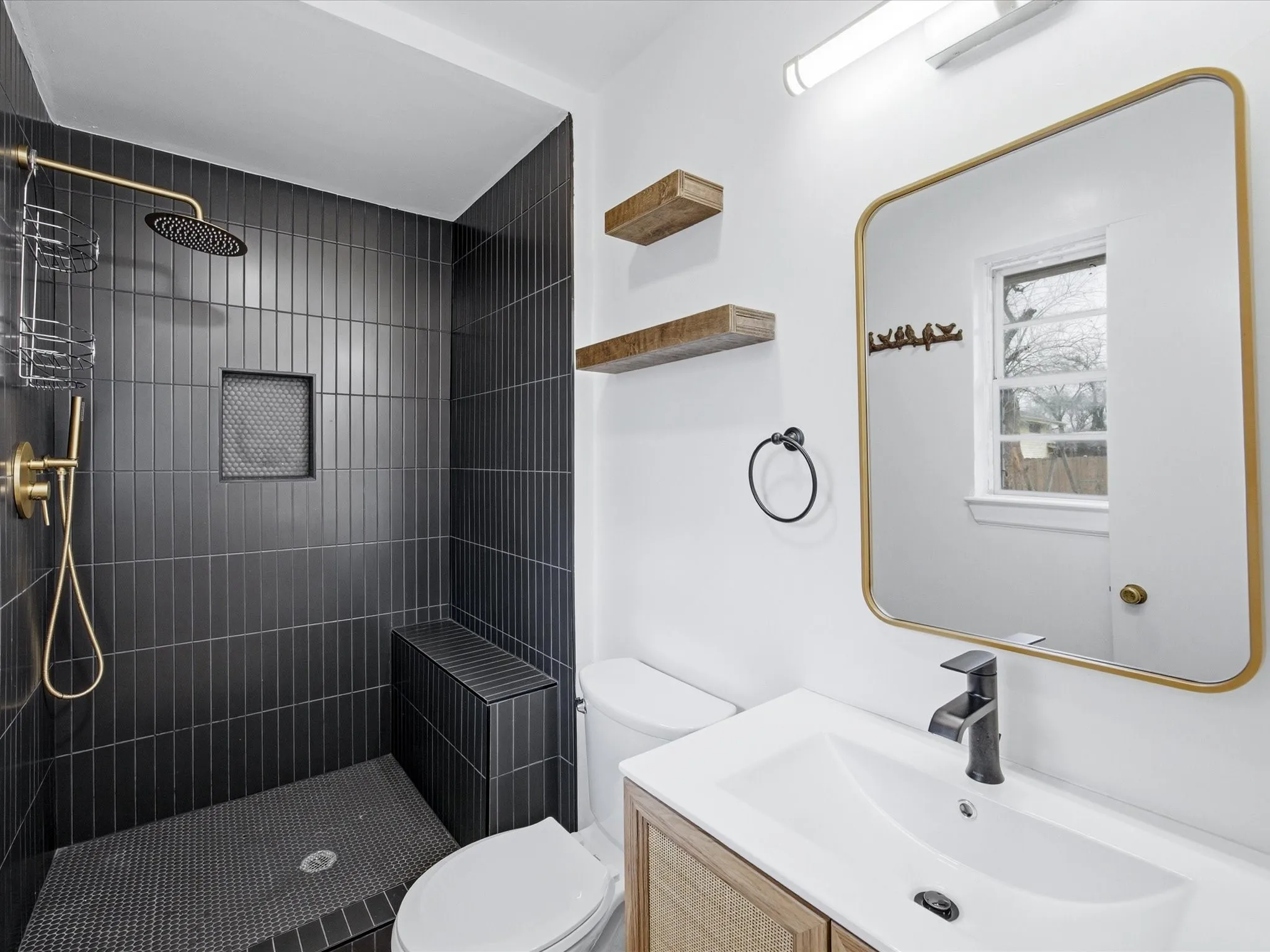Primary Bathroom with a tile shower and vanity