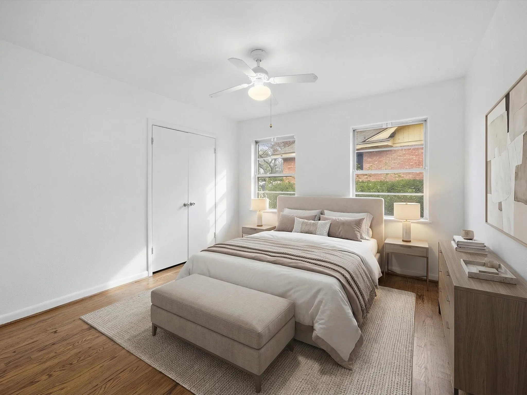 Bedroom featuring wood finished floors and a ceiling fan