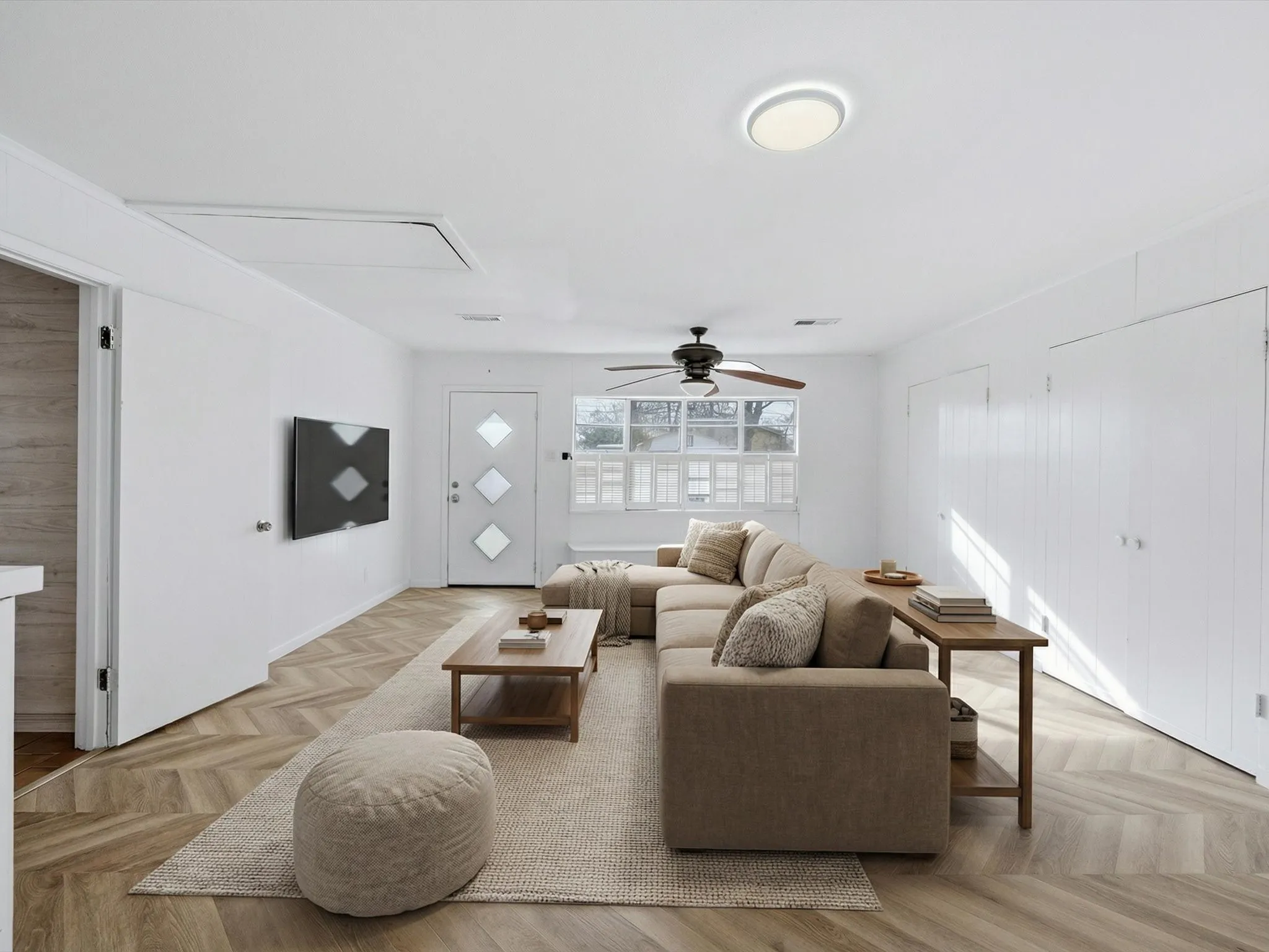 Living room featuring parquet flooring and ceiling fan