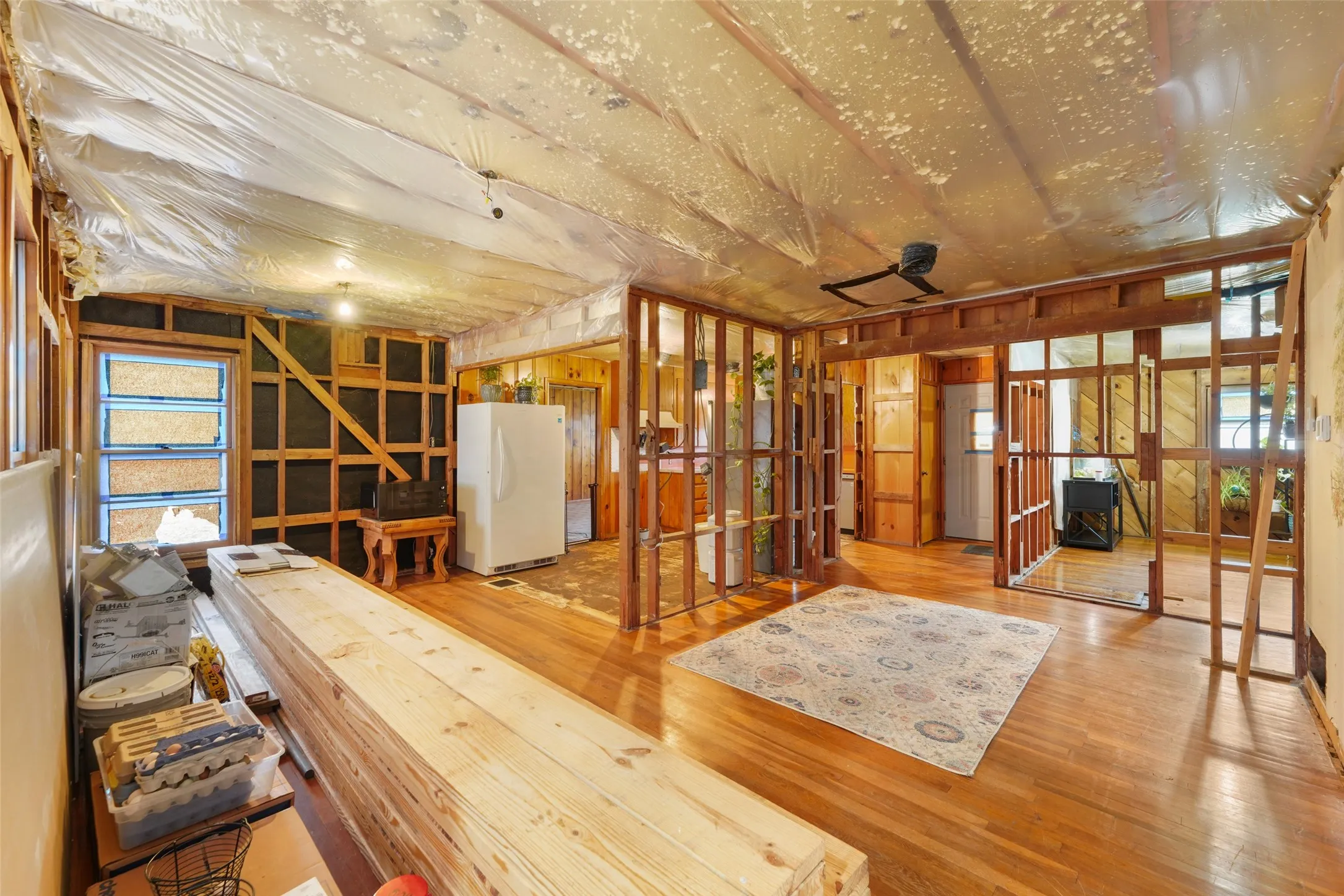 Looking at kitchen and front door, dining to the left