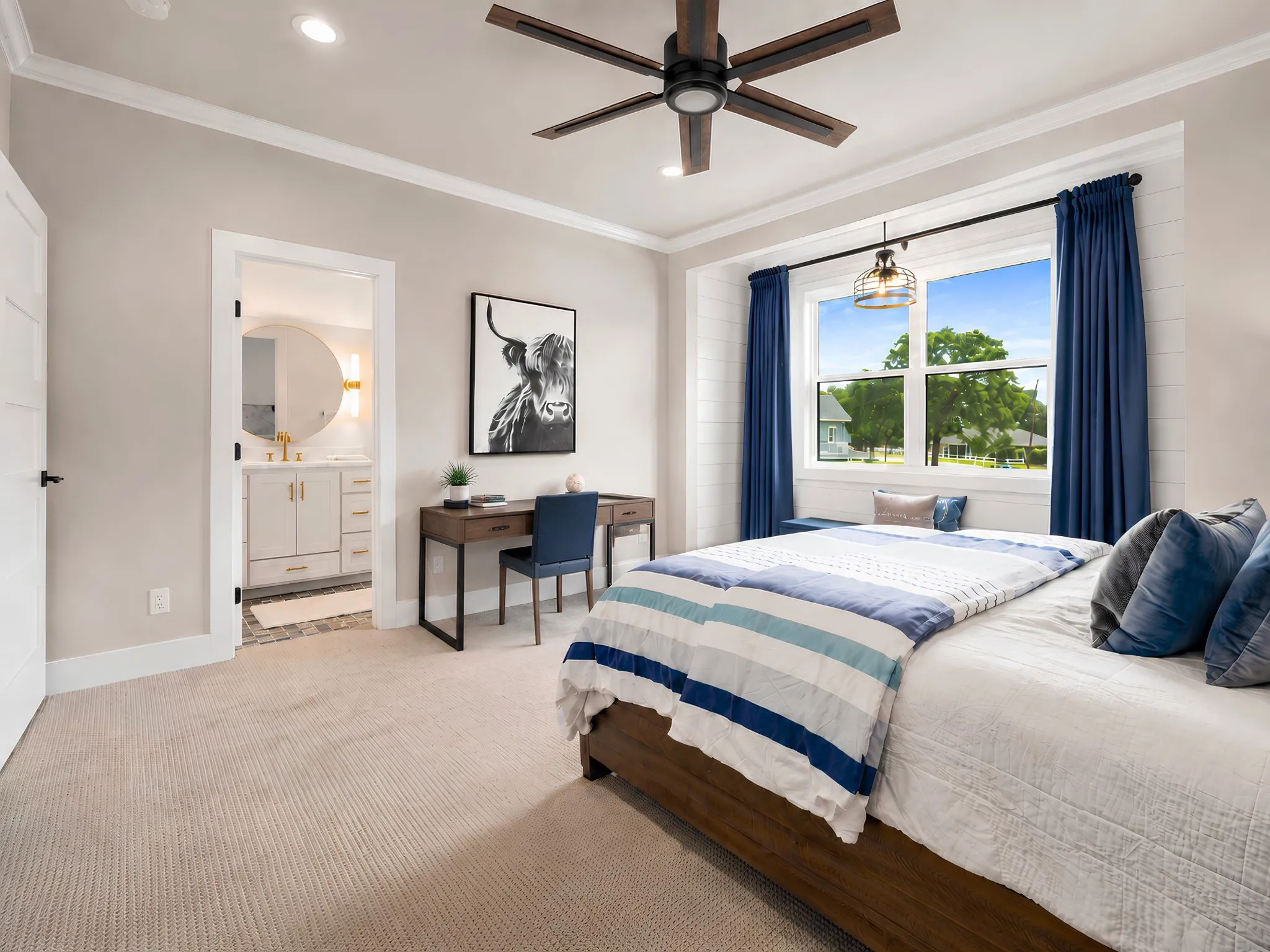 Bright sleeping area featuring a ceiling fan with light fixture, carpet flooring, and a large window with a built-in window seat