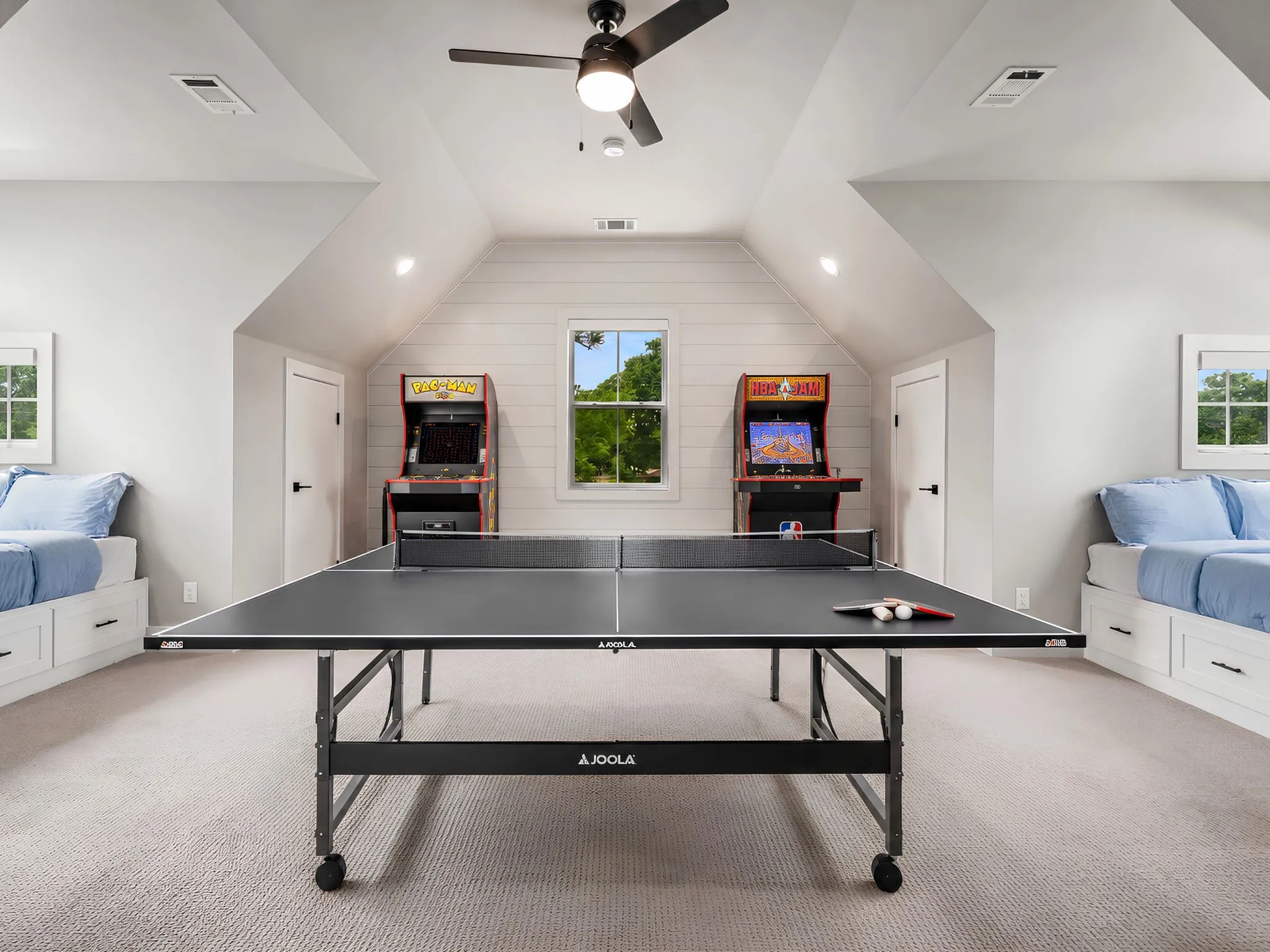 Spacious bonus room featuring sloped ceilings, recessed lighting, and a neutral carpet