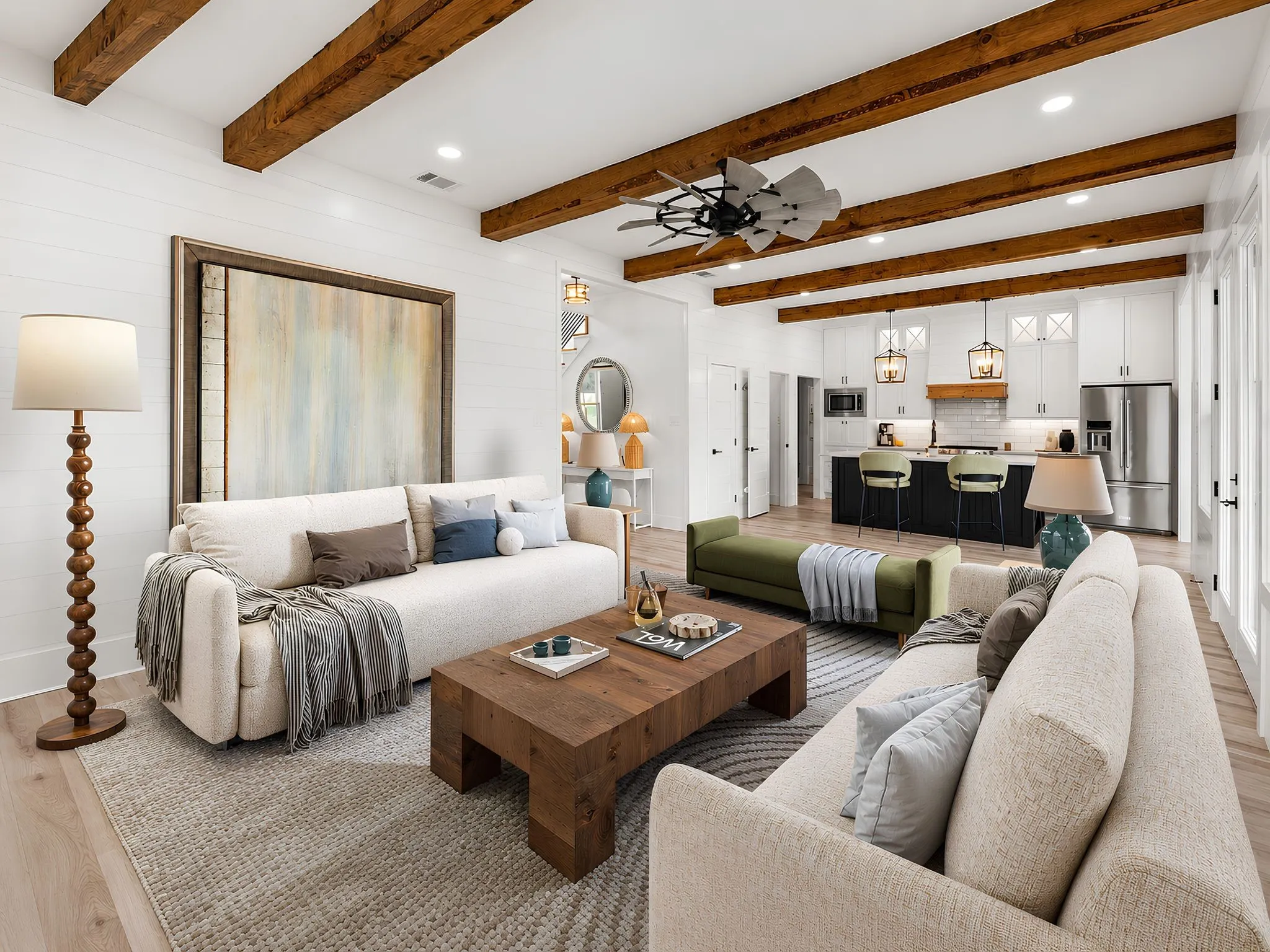 Open-concept living space featuring wood-finish flooring, exposed ceiling beams, white shiplap walls, and recessed lighting