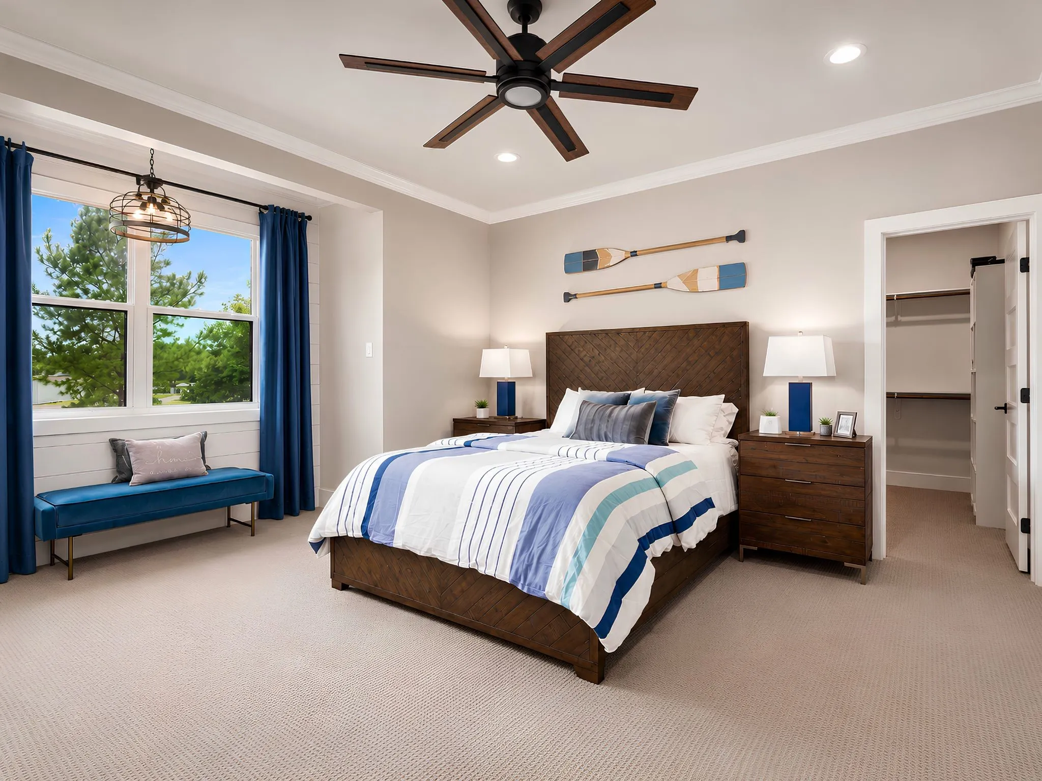 Bedroom featuring a large window with white trim, a ceiling fan with integrated lighting, recessed lighting, crown molding, and neutral-toned carpeting