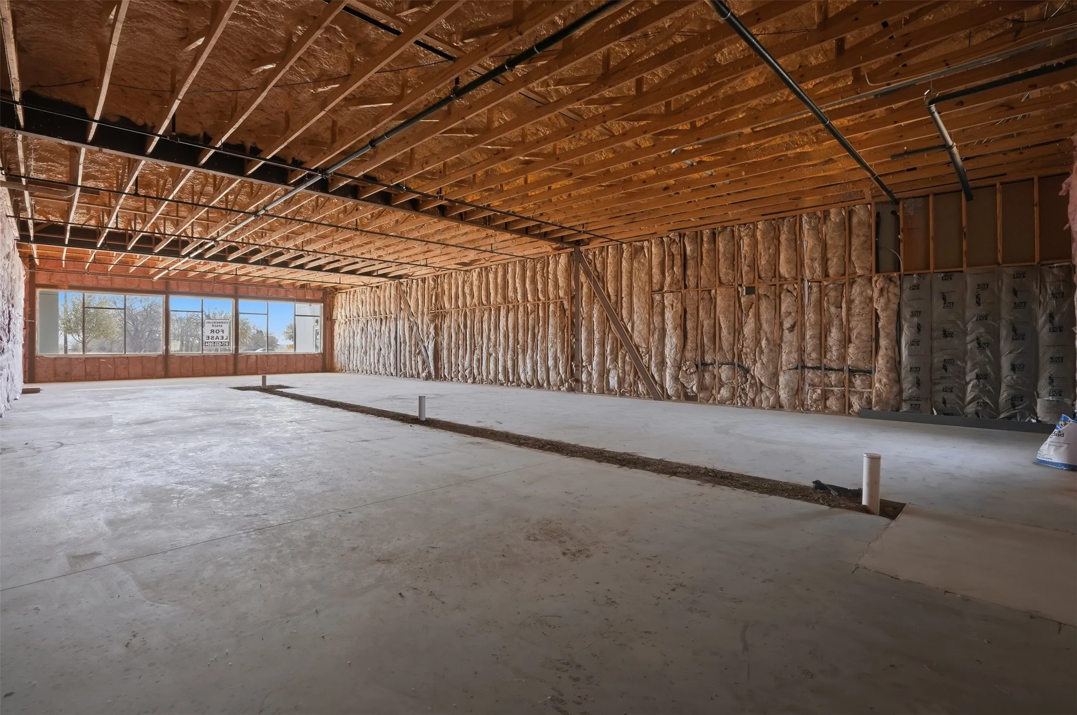 Miscellaneous room featuring concrete floors and a garage