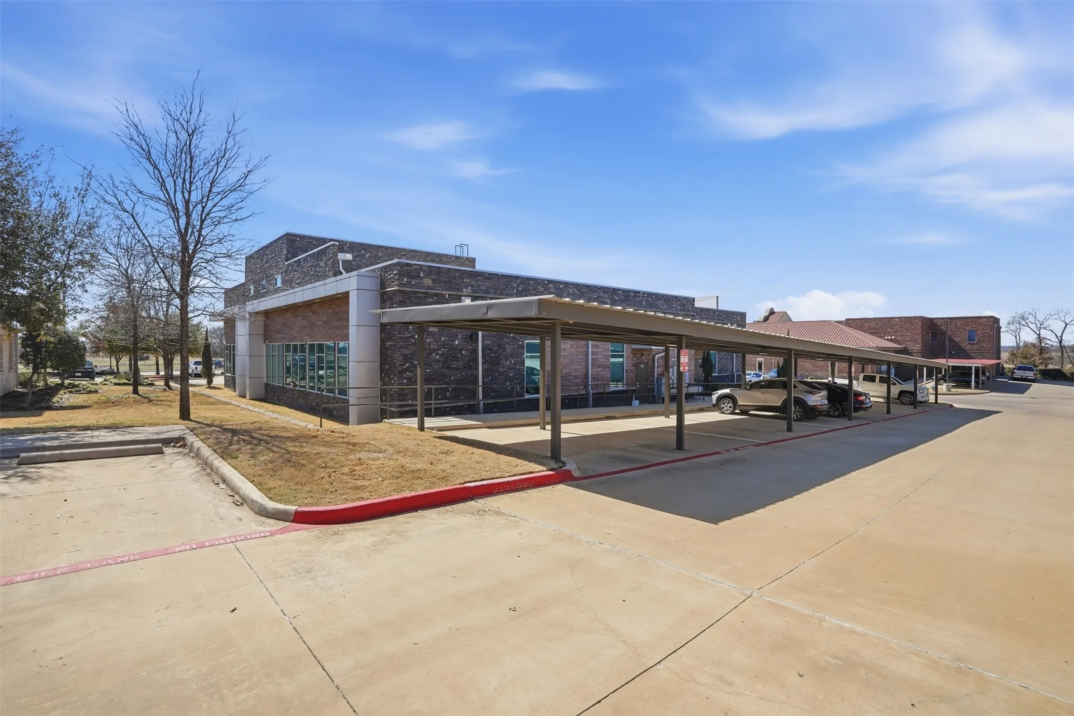 View of community with covered parking