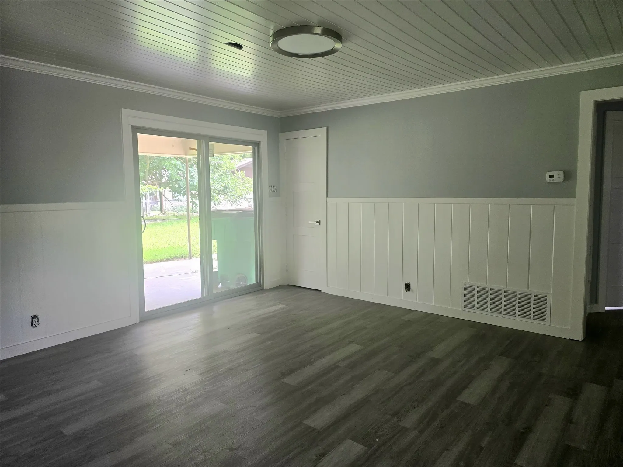 2nd living area/gameroom with updated sliding doors.