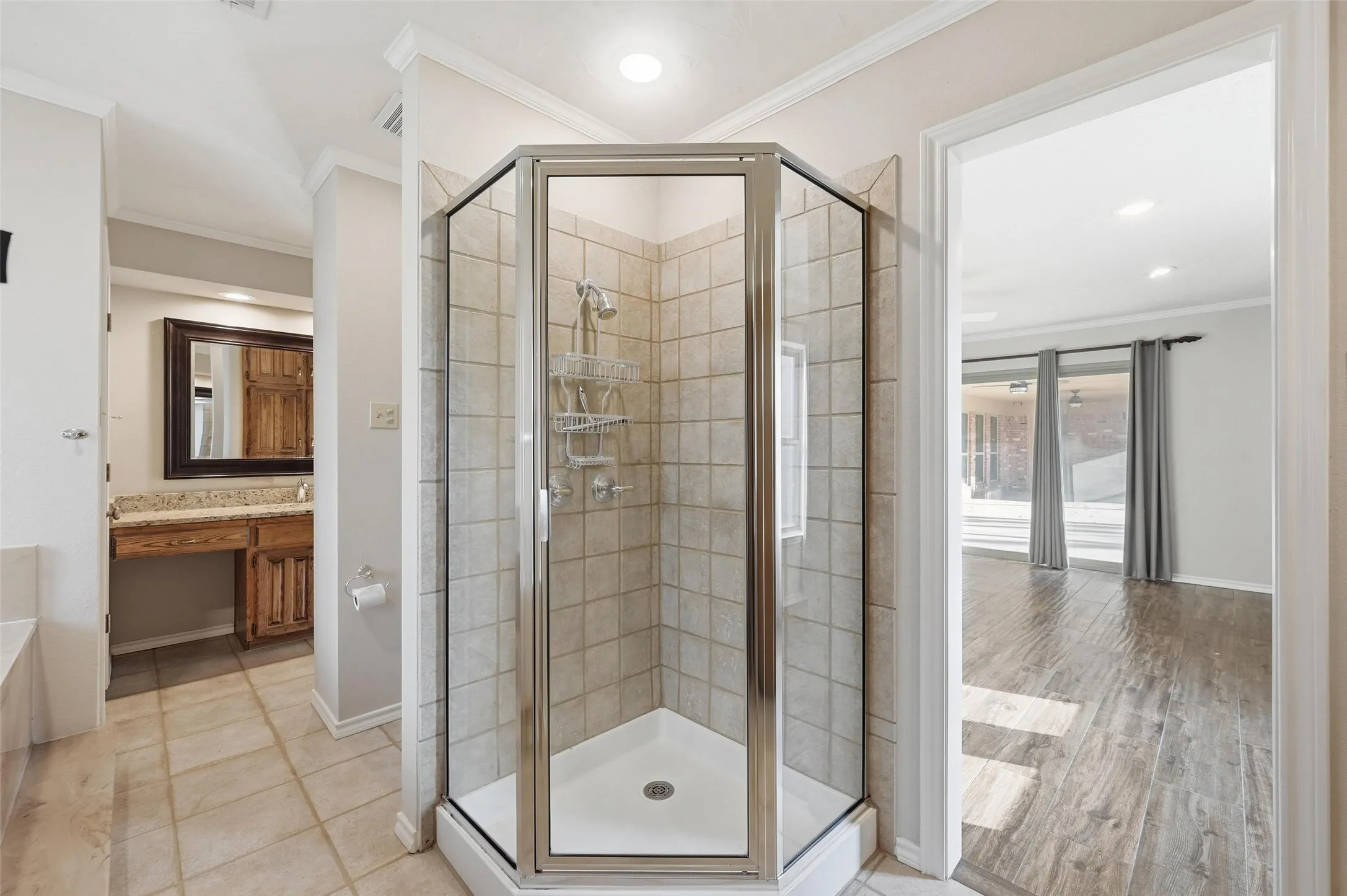 Full bath featuring ornamental molding, a stall shower, vanity, recessed lighting, and a garden tub