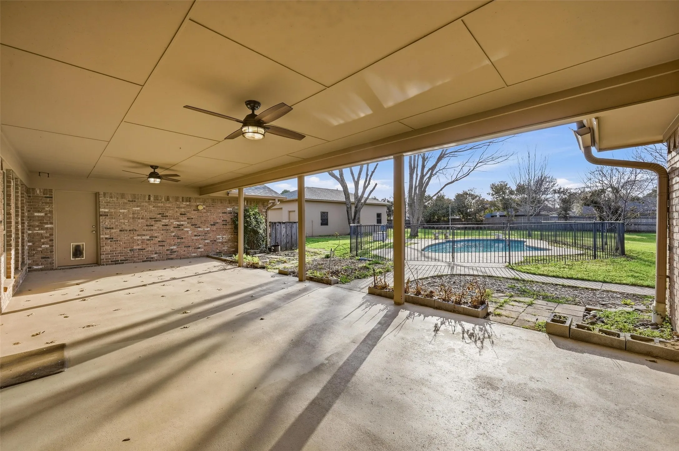 View of patio featuring ceiling fan