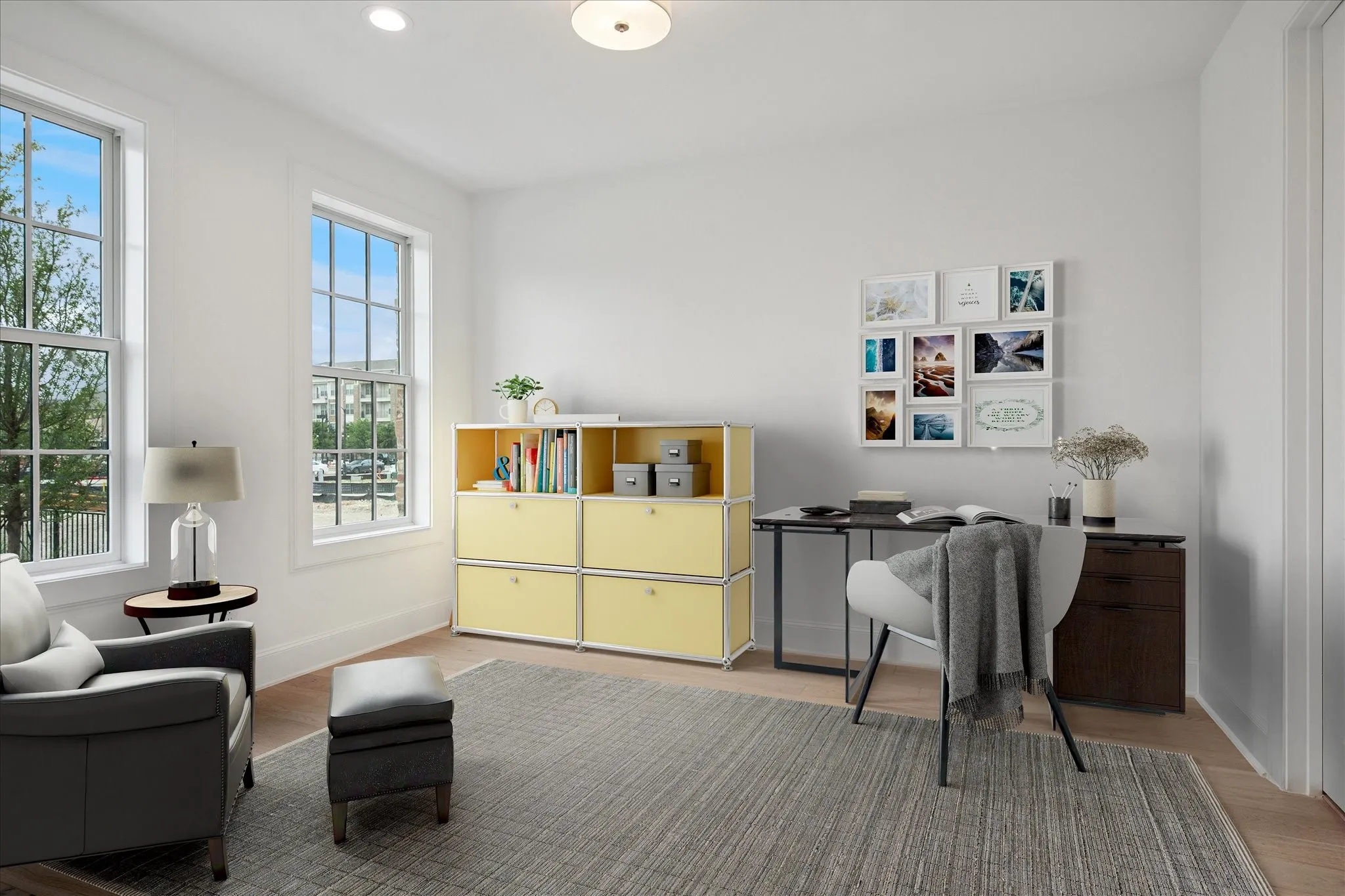 Office space featuring light wood finished floors and recessed lighting