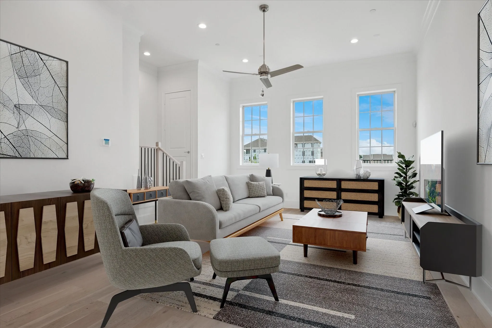 Living area with light wood-style floors, ceiling fan, recessed lighting, and crown molding