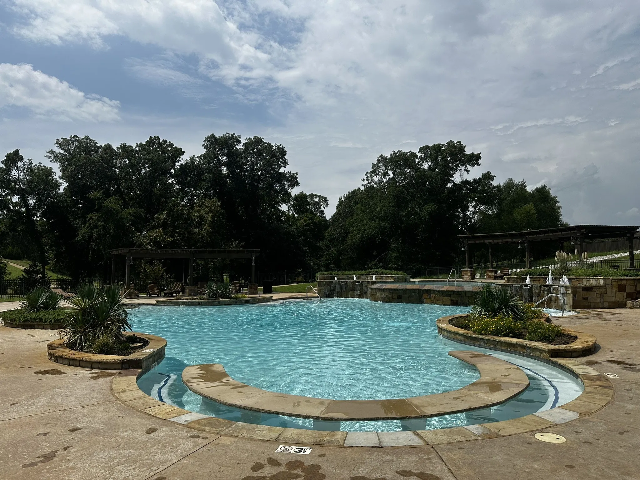 Community pool featuring a patio