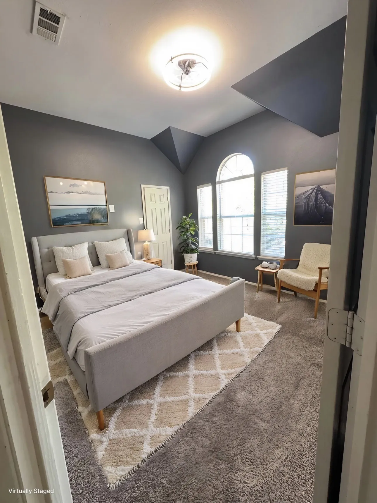 Bedroom with carpet and vaulted ceiling