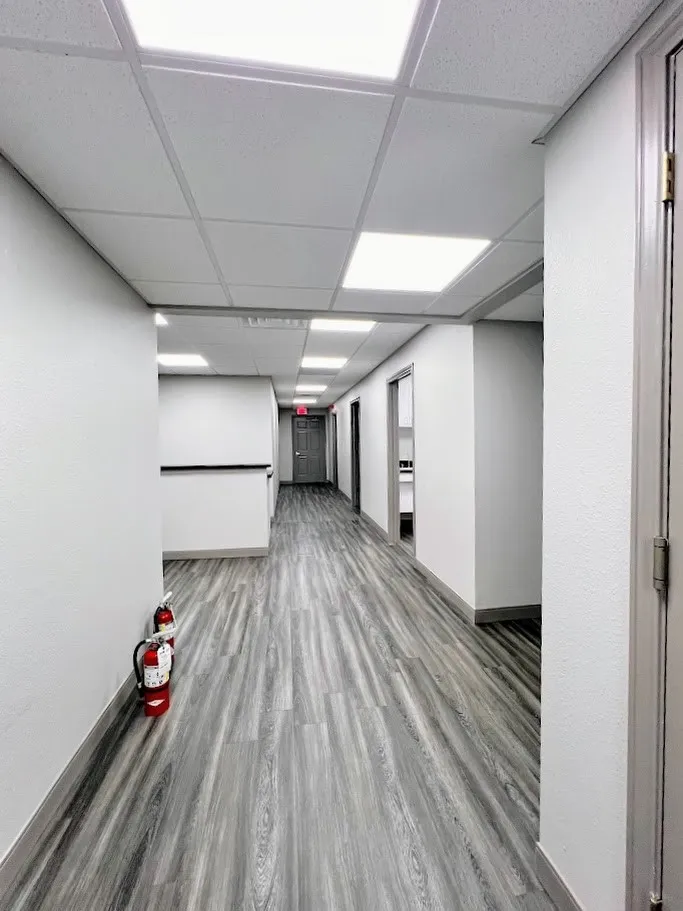 Spare room featuring a drop ceiling and light wood-style flooring