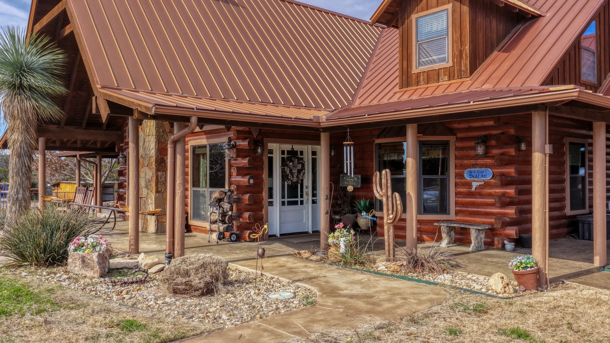 Front entrance to this home.  Notice the metal roof and large porches.
