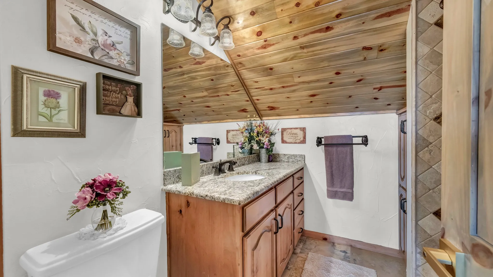 Upstairs bathrooms are both complete with tub/shower combination, cabinets. large mirror and sink.