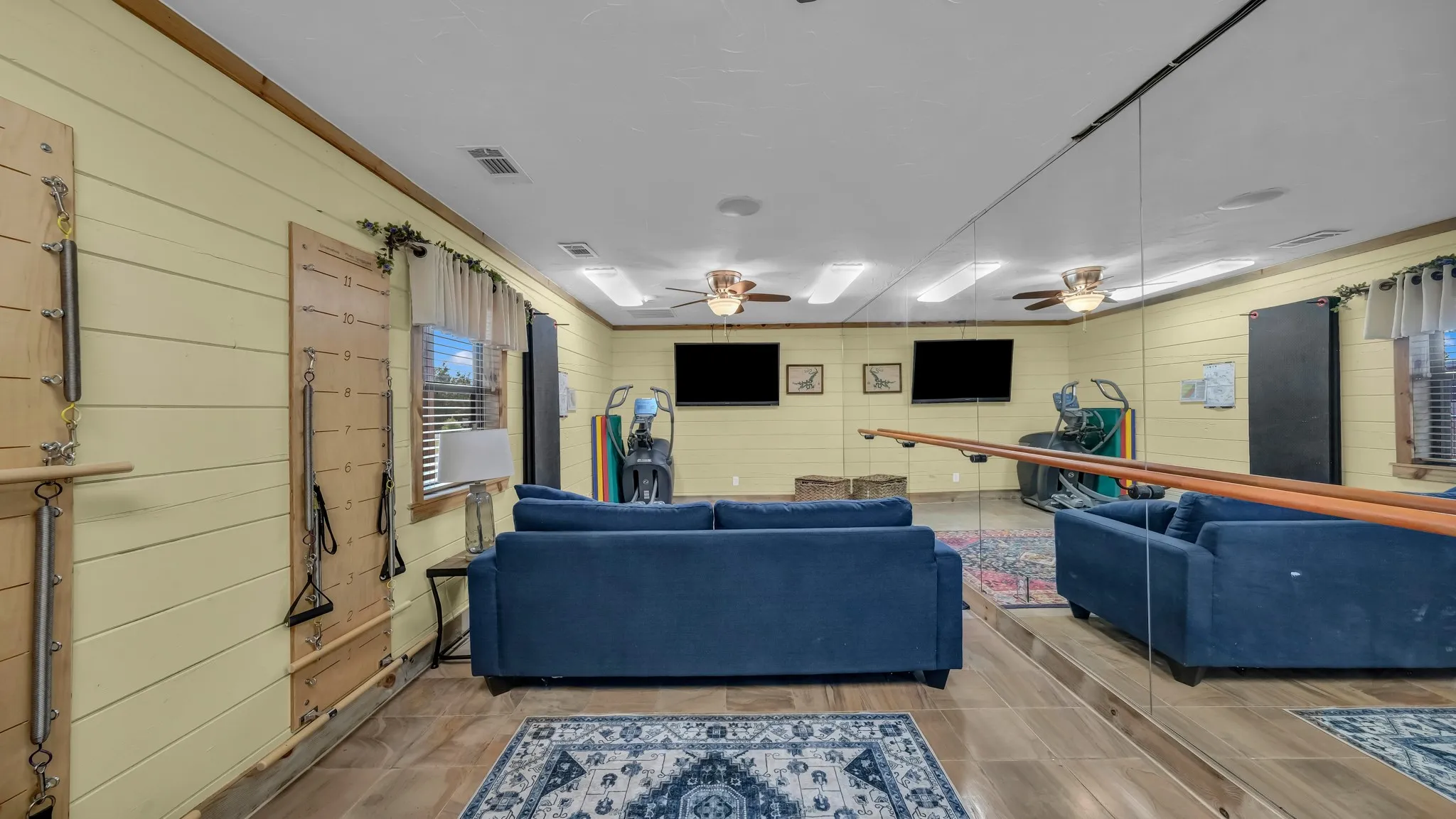 Downstairs living area in barn can be used for a large variety of purposes. Half bath is downstairs also.