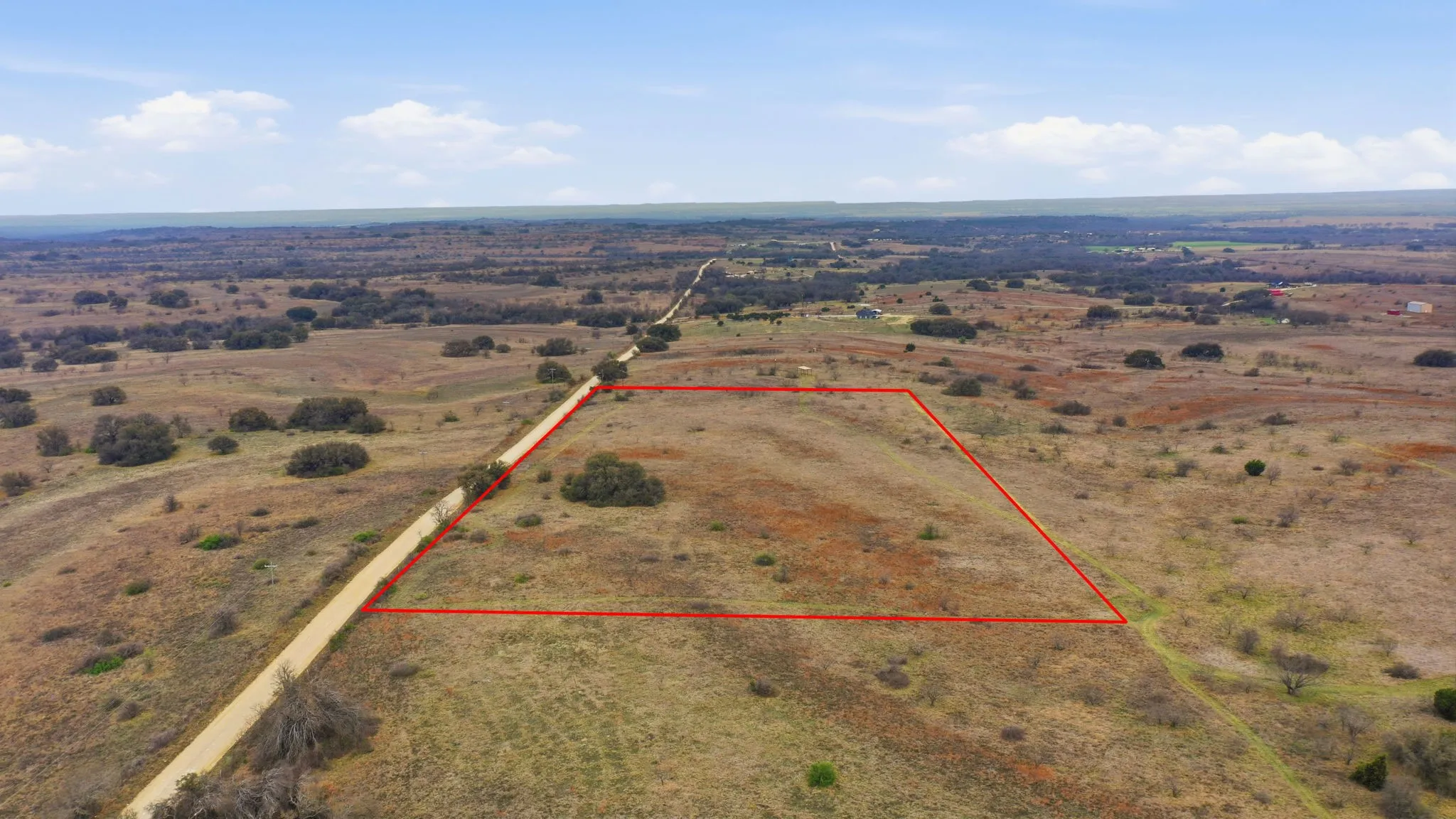 Overview of rural landscape with property parcel outlined