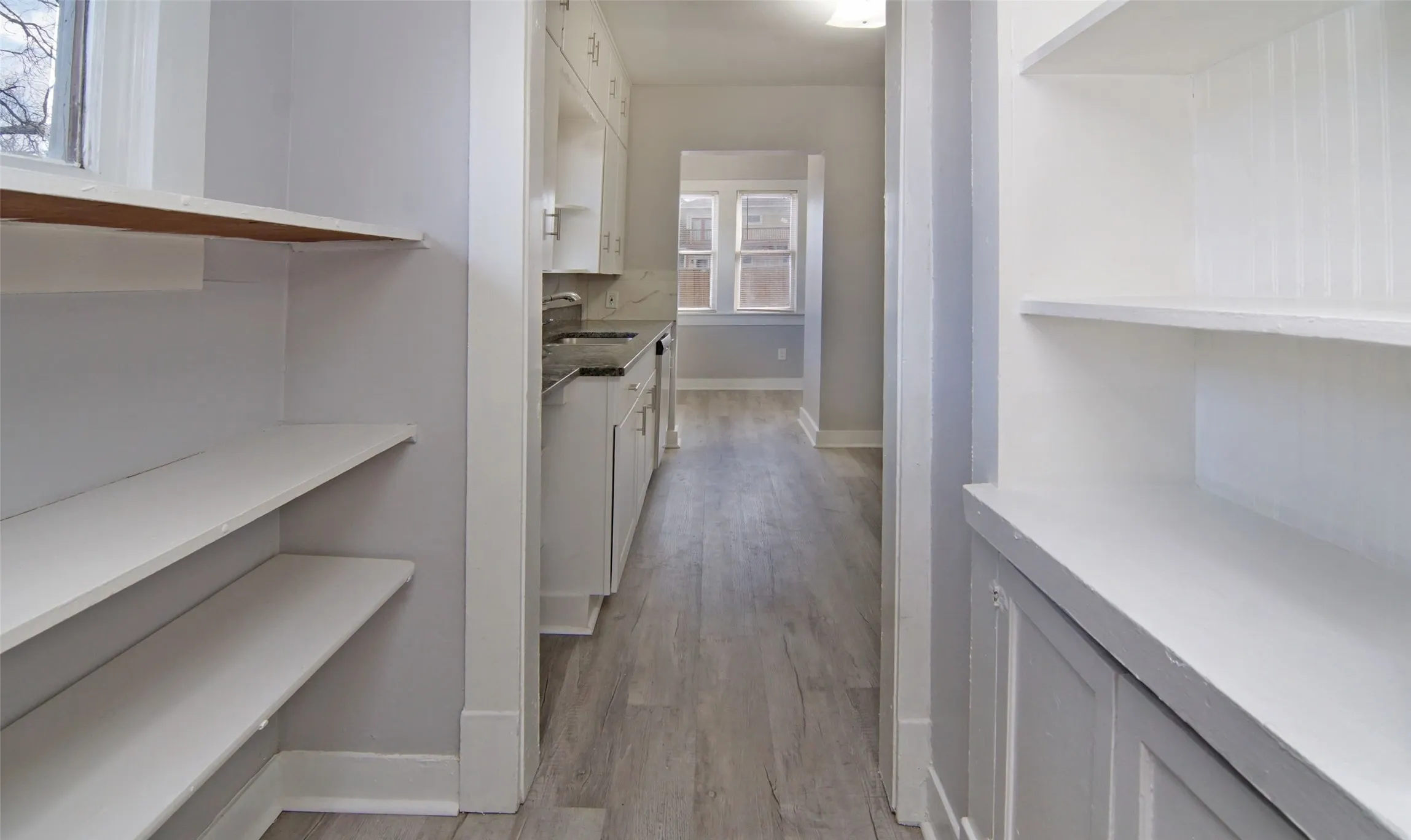 Walk through pantry with a swinging door