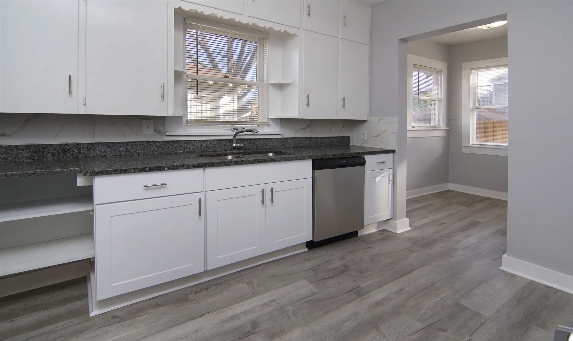 Natural light, leads to the back of home and utility room