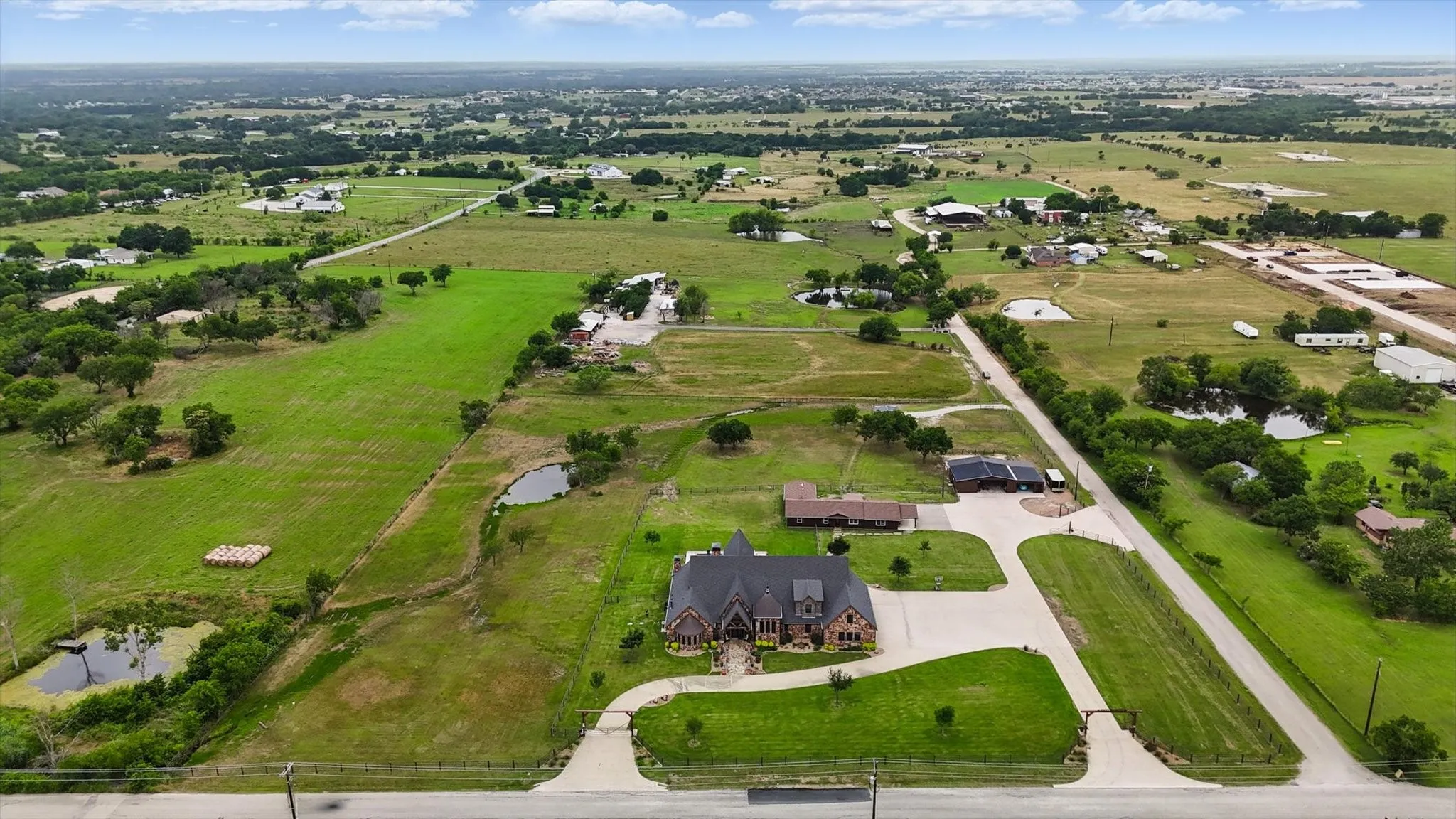 Aerial overview of property's location featuring rural landscape