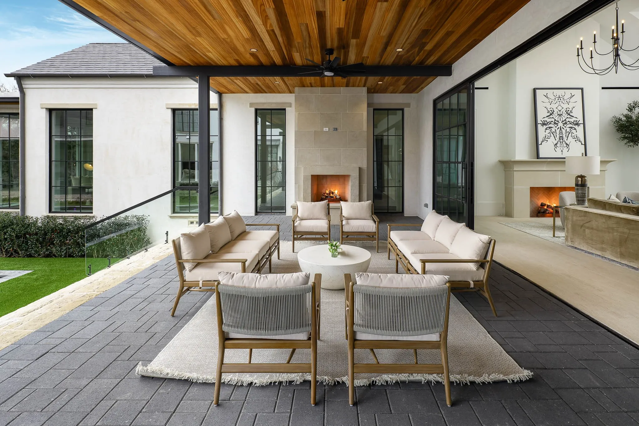 Outdoor covered loggia with gas fireplace off of great room