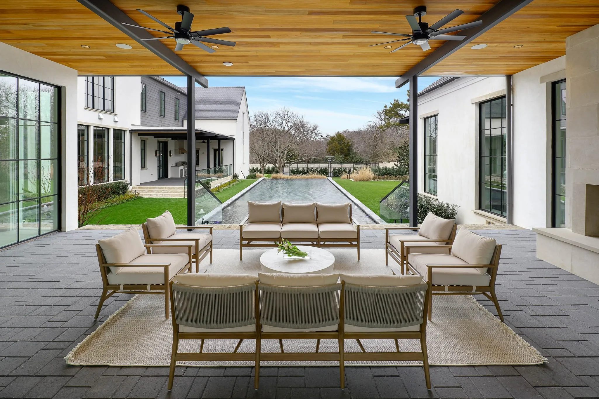 Outdoor covered loggia with gas fireplace off of great room