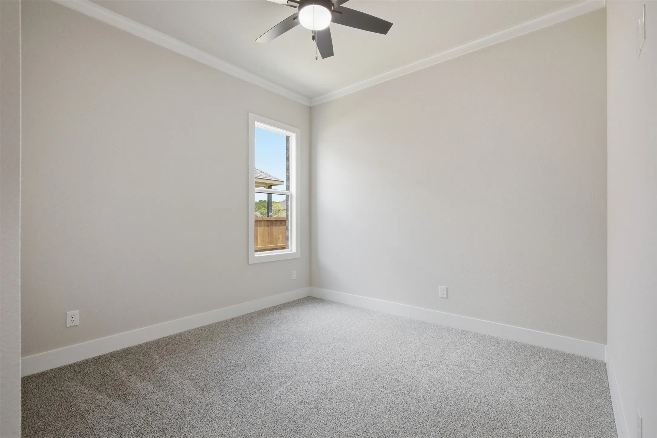 Neutral tone walls with crown molding and white trim