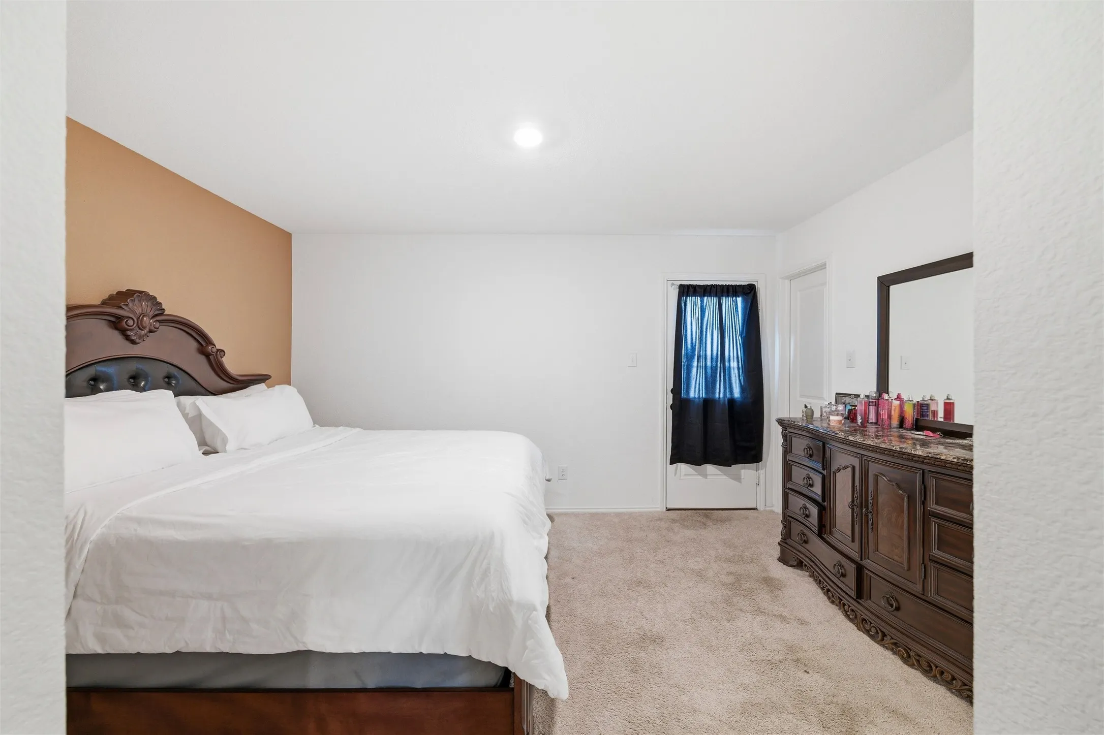 Bedroom with light carpet