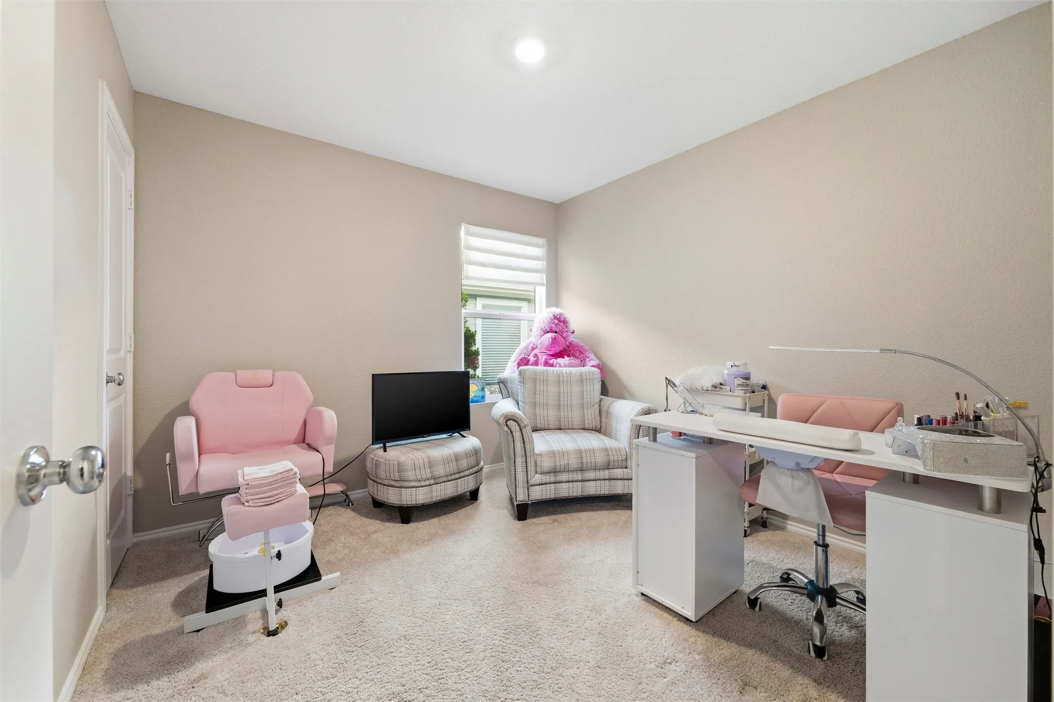 Office featuring light carpet and baseboards