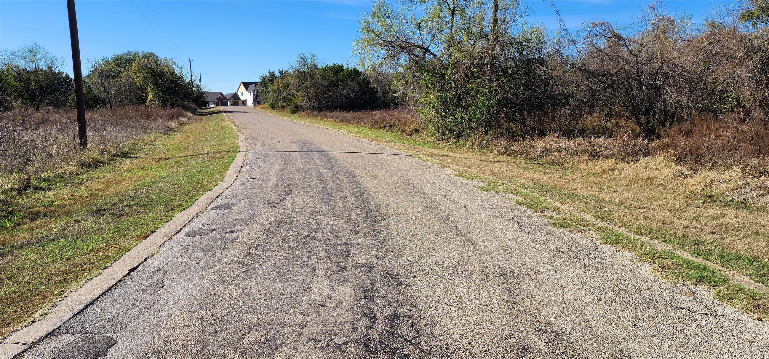 View up the road from in front of the lot