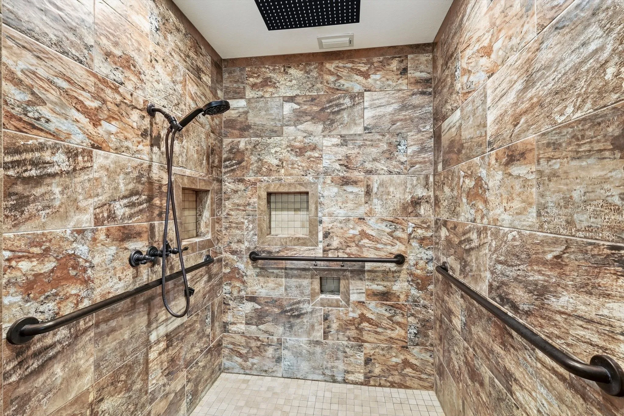 Bathroom featuring a tile shower
