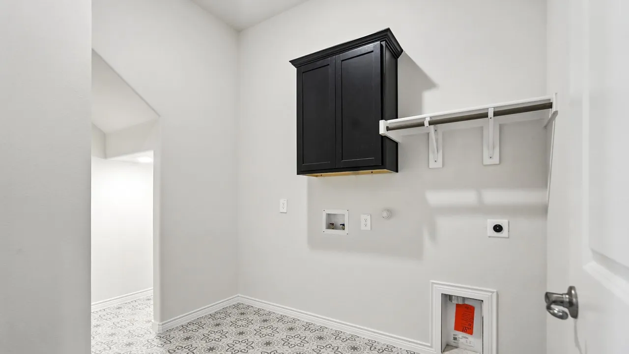 Laundry room featuring hookup for a gas dryer, hookup for an electric dryer, cabinet space, and washer hookup