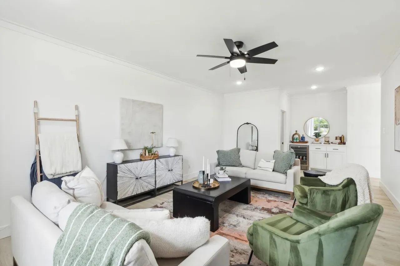 Living room featuring beverage cooler, light wood finished floors, ornamental molding, ceiling fan, and recessed lighting
