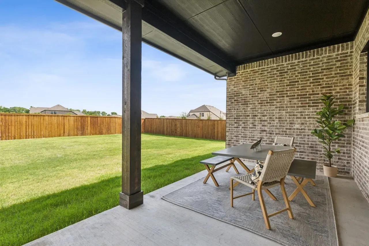 Fenced backyard featuring a patio and outdoor dining area