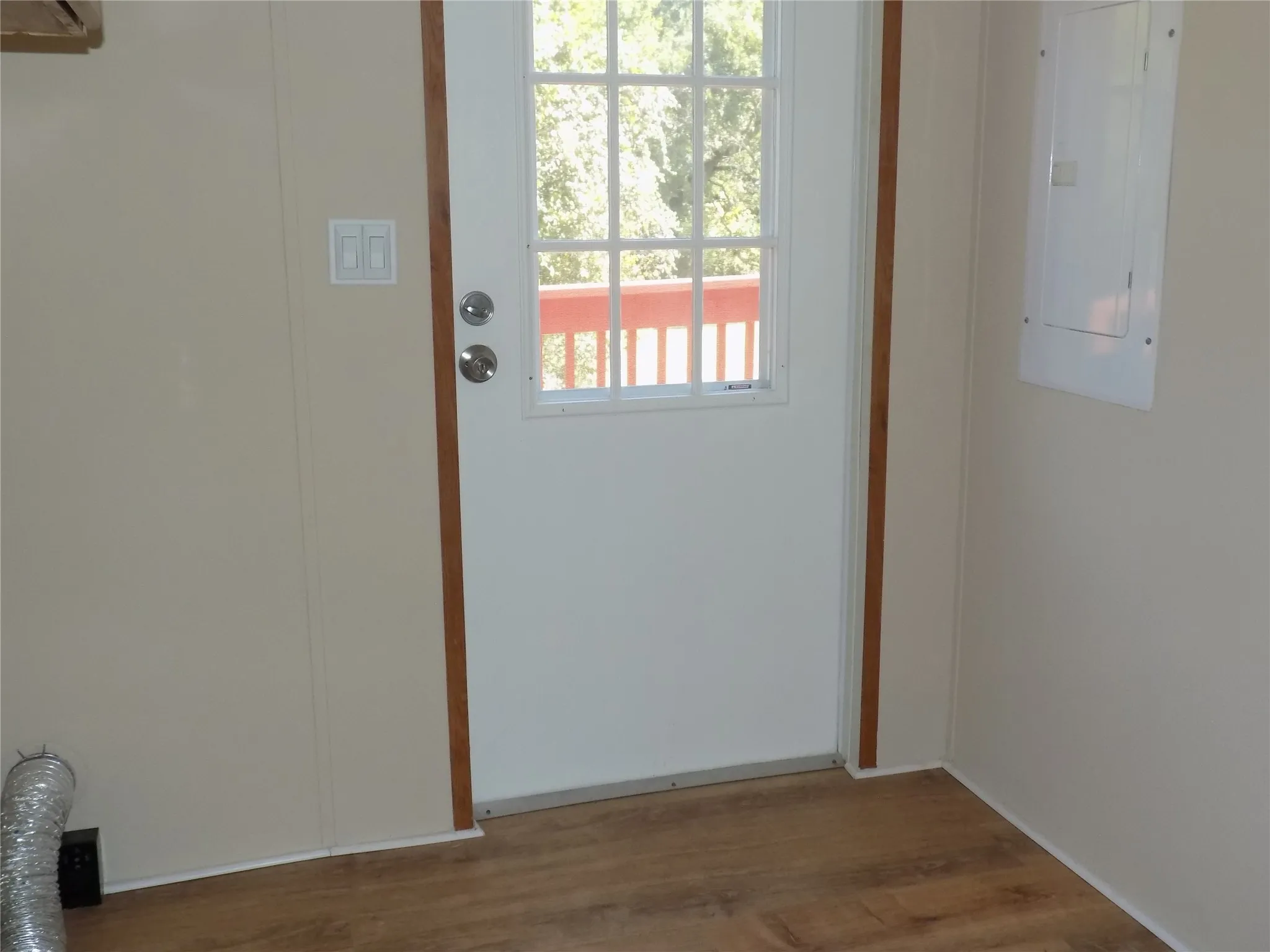 Door in laundry room to the outside; panel box handy.