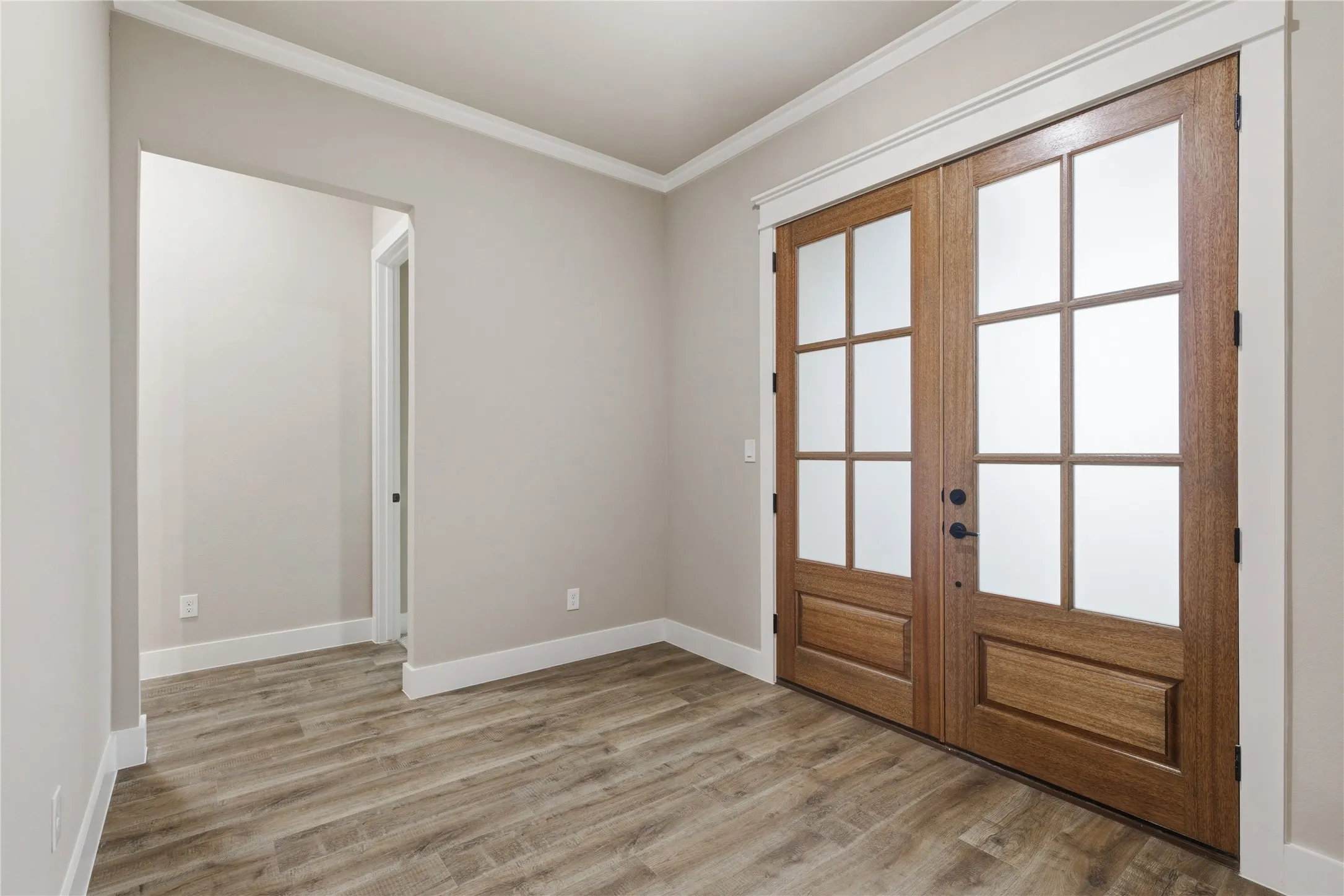Double French doors featuring frosted glass panels
