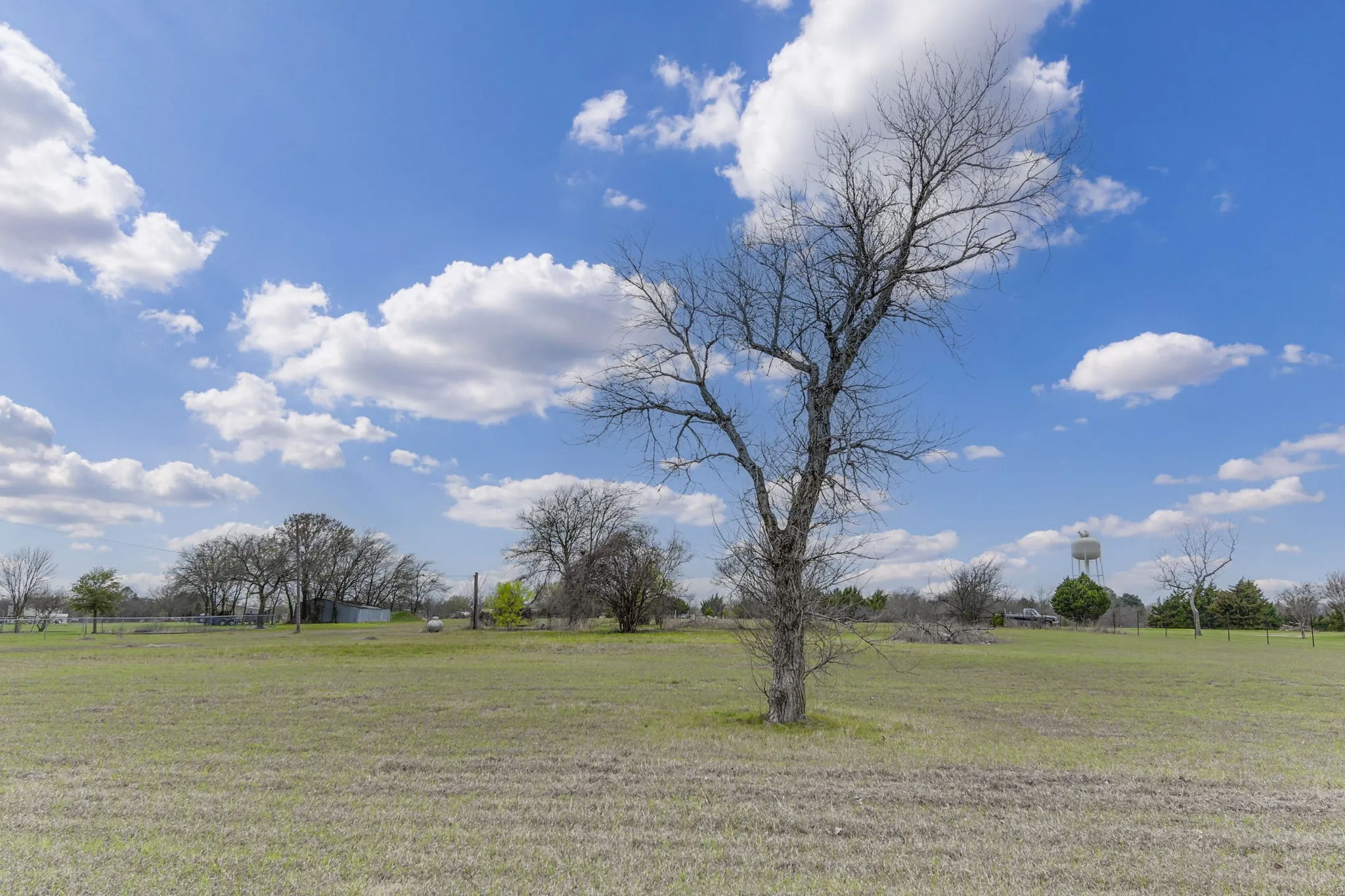 View of green lawn featuring a rural view