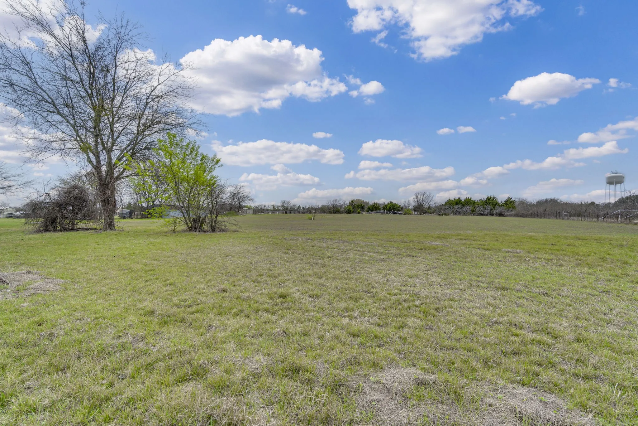 View of green lawn with a view of countryside
